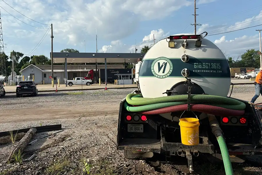 V1 Environmental company truck and septic pump parked across from a bank, septic pumping for commercial properties - Southern Illinois